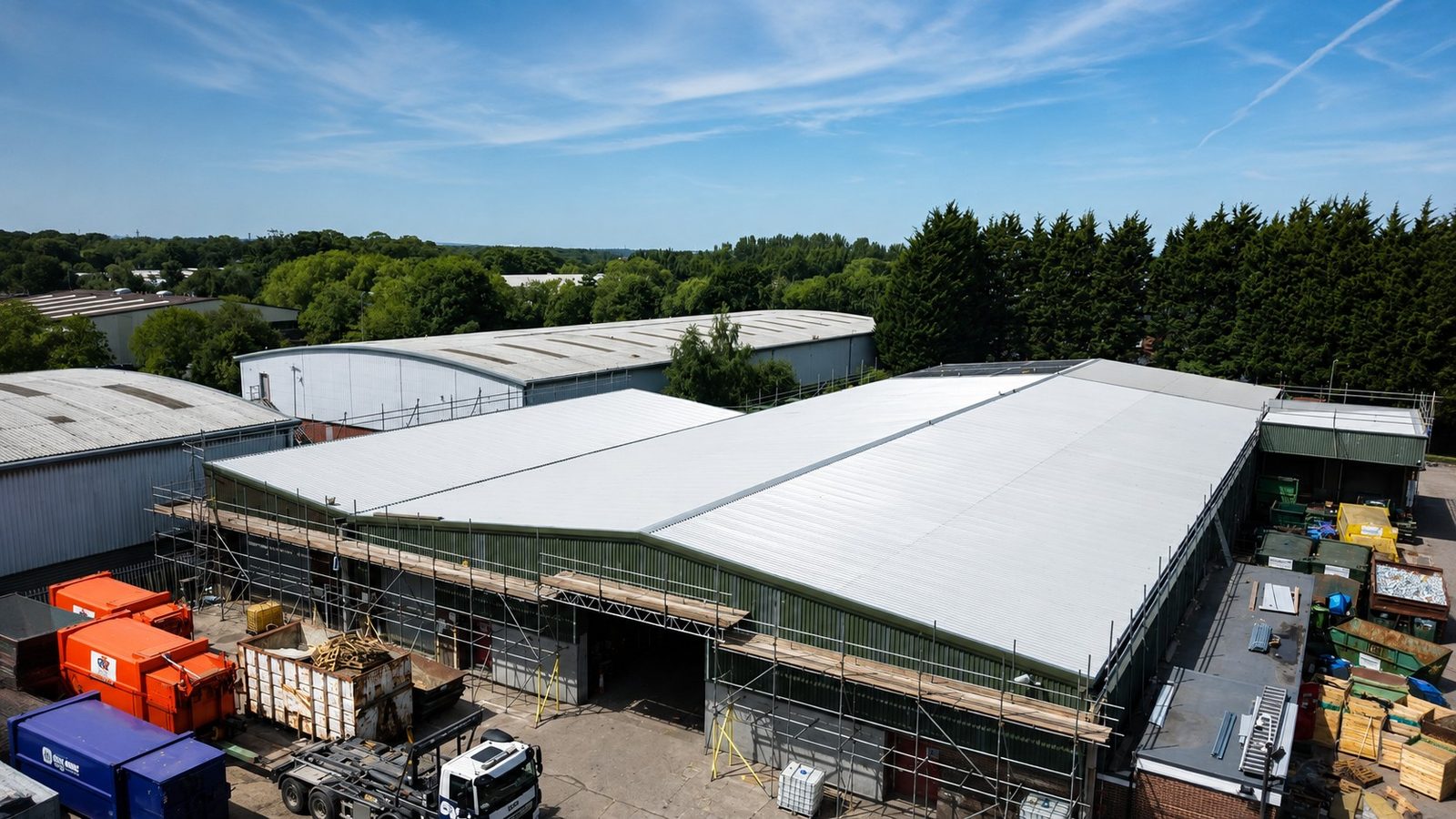 Newly sheeted industrial roof seen from above with scaffolding in place