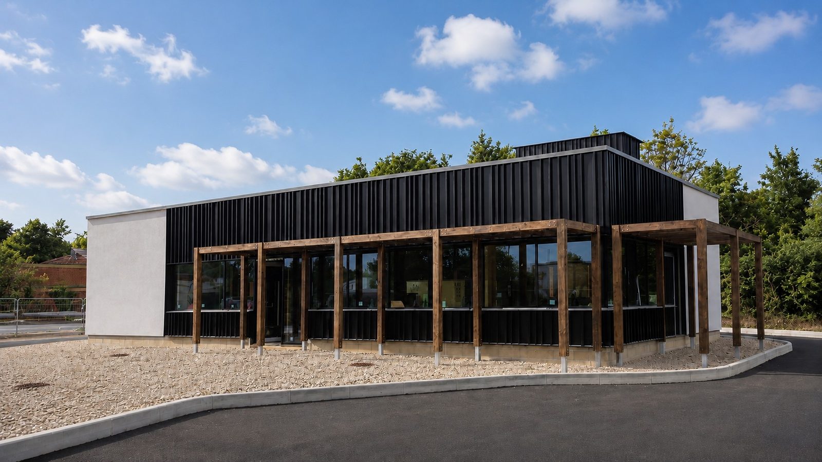 Completed Starbucks drive-thru with black vertical cladding